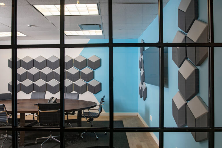 Custom design conference room acoustic treatment with custom shape acoustic panels